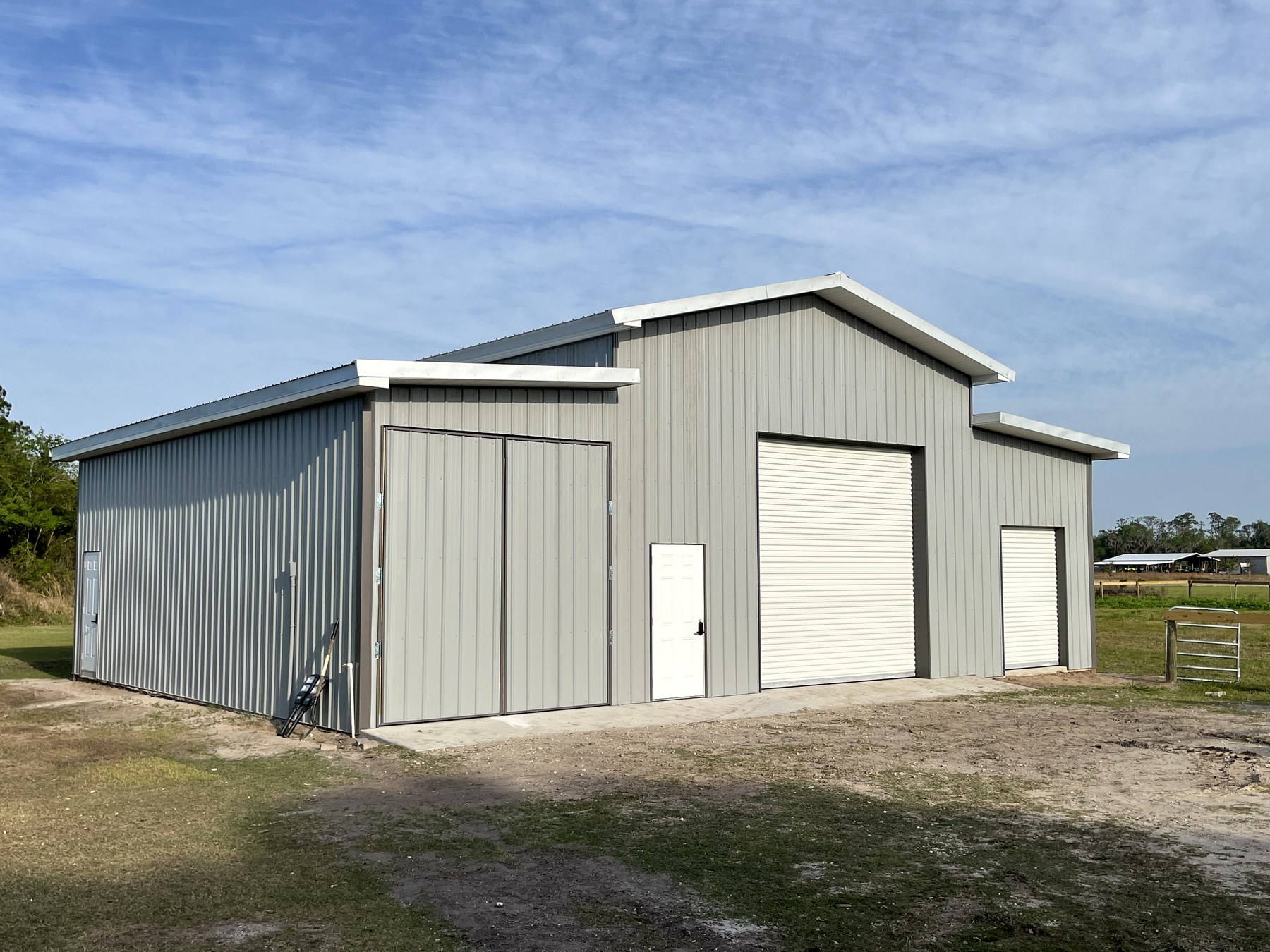 Real large enclosed Johnson Pole Barns equipment and workshop building